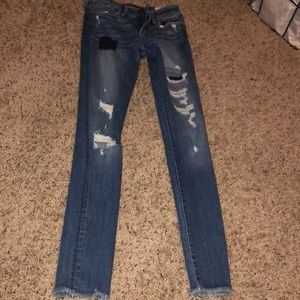 dark wash patch and ripped jeans